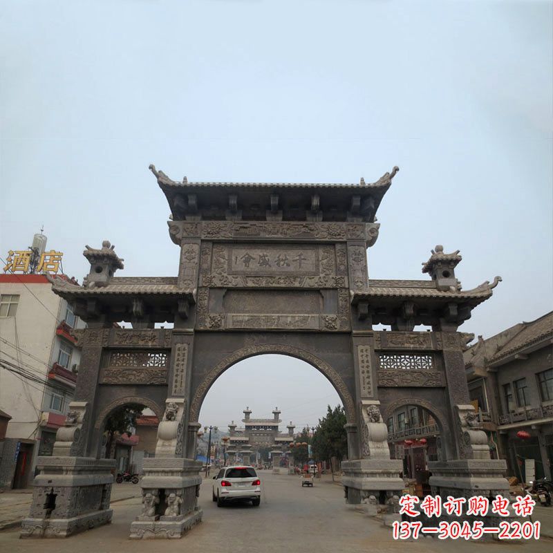 贵阳城市街道仿古三门石雕牌楼