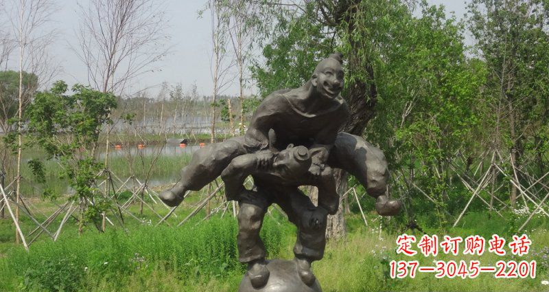 贵阳园林站在球上面跳山羊的人物景观铜雕